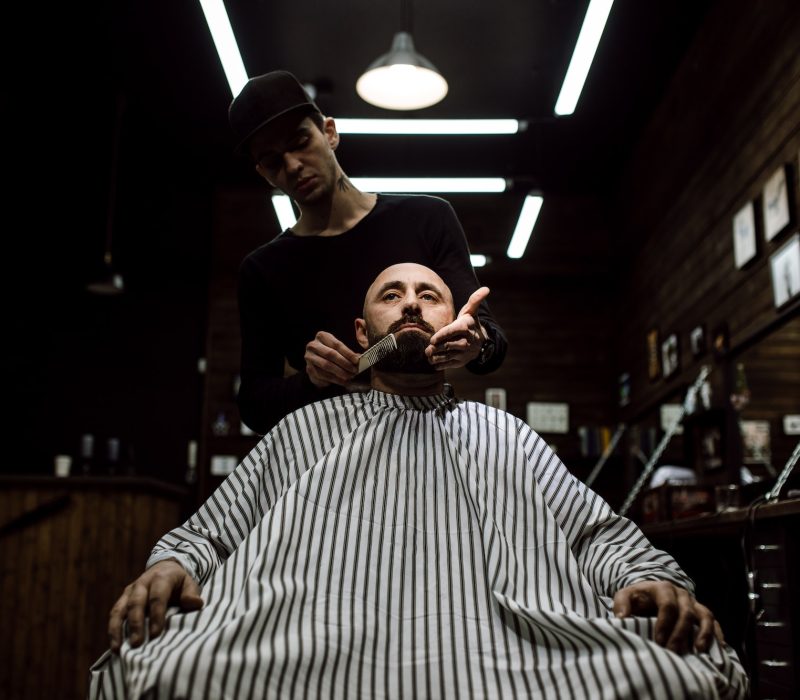 the-stylish-barbershop-the-fashion-barber-tidies-up-beard-of-brutal-man-sitting-in-the-armchair-1.jpg